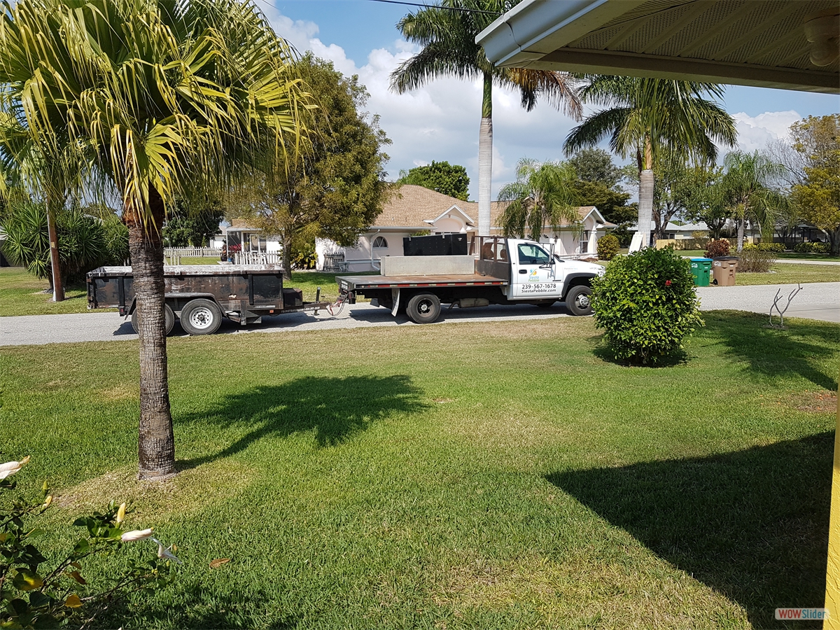 ... to the trailer in front of the house. ... to the trailer in front of the house.