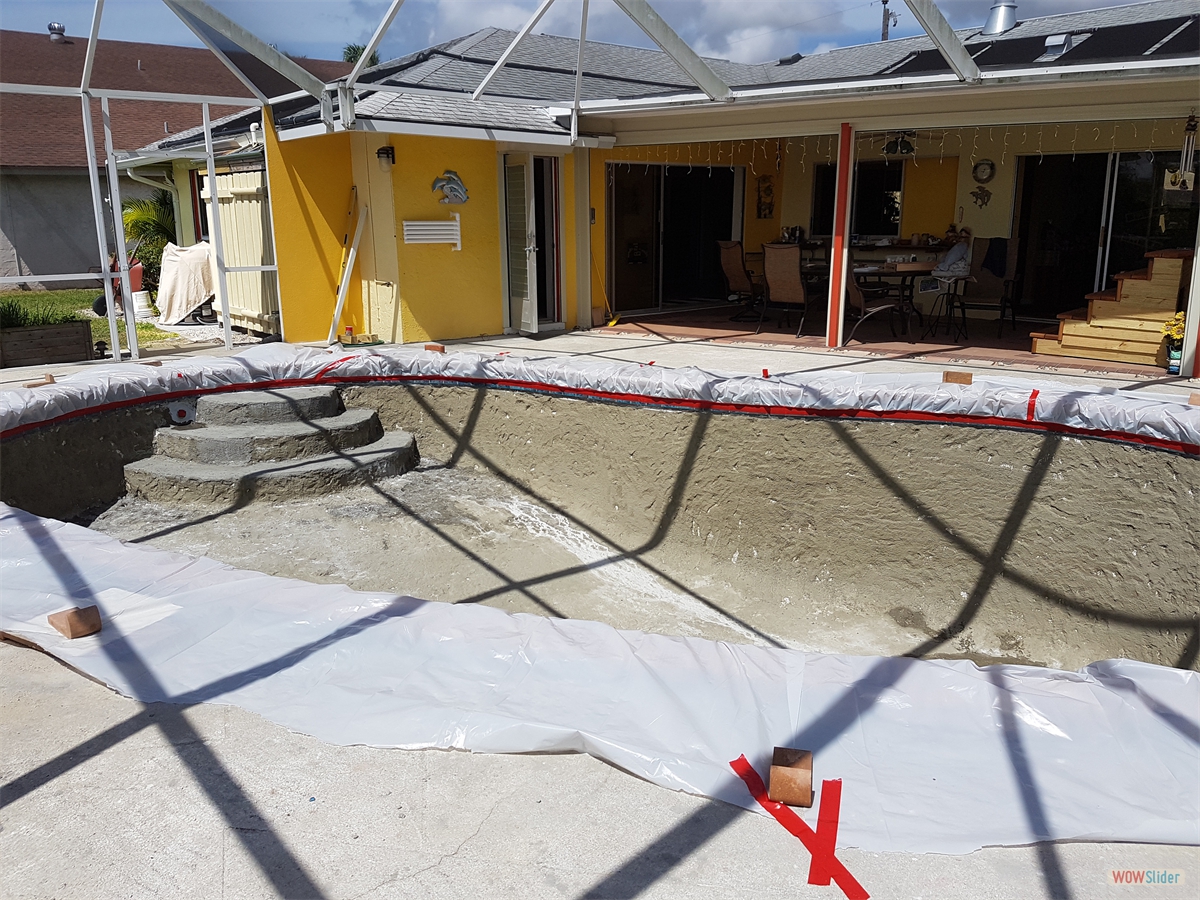 ... tiles and coping are wrapped in tarp for protection. ... tiles and coping are wrapped in tarp for protection.