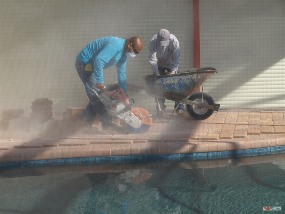 ... the pavers are cut causing a dust cloud ... ... the pavers are cut causing a dust cloud ...