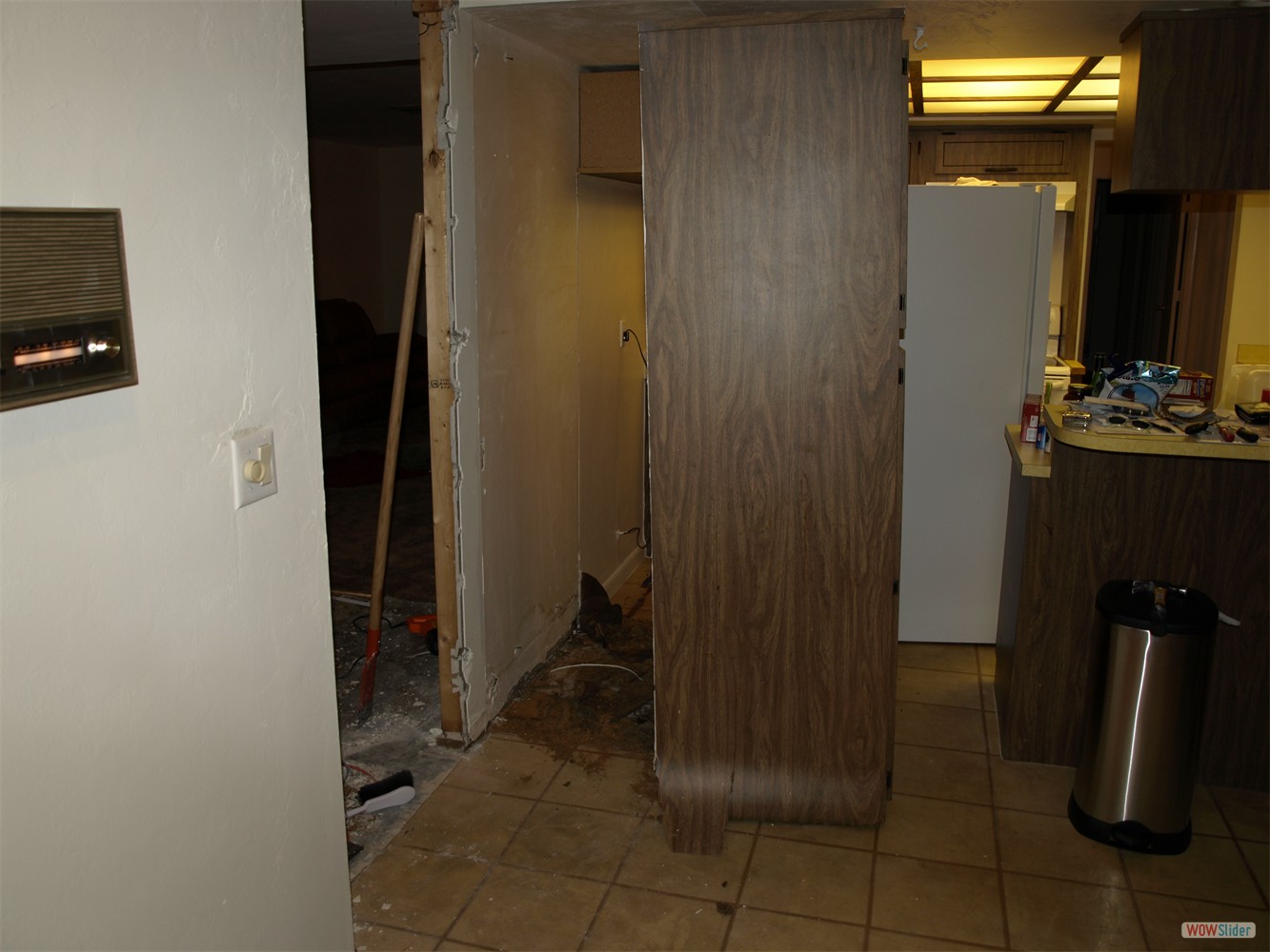 This tall cabinet stood beside ... This tall cabinet stood beside ...