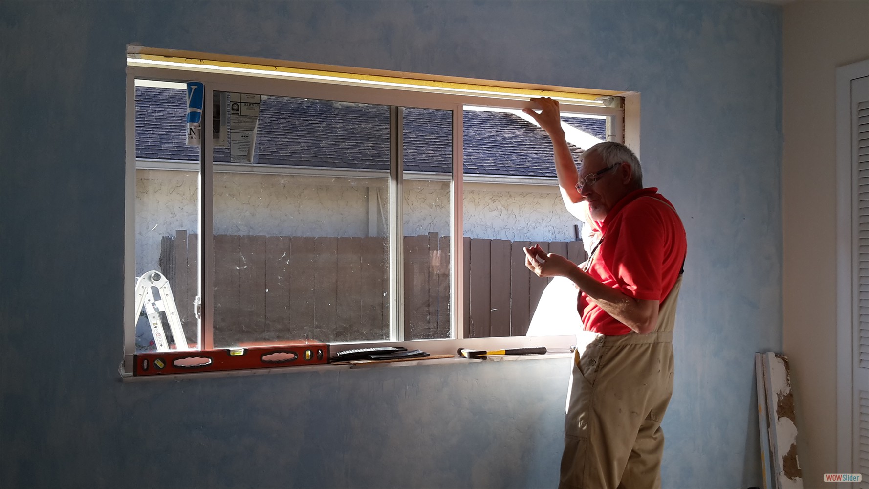 ... then the new window is fitted, ...