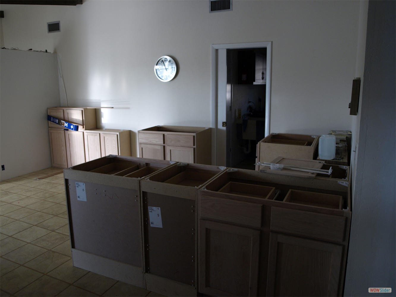 The untreated kitchen cabinets waiting to be painted ...