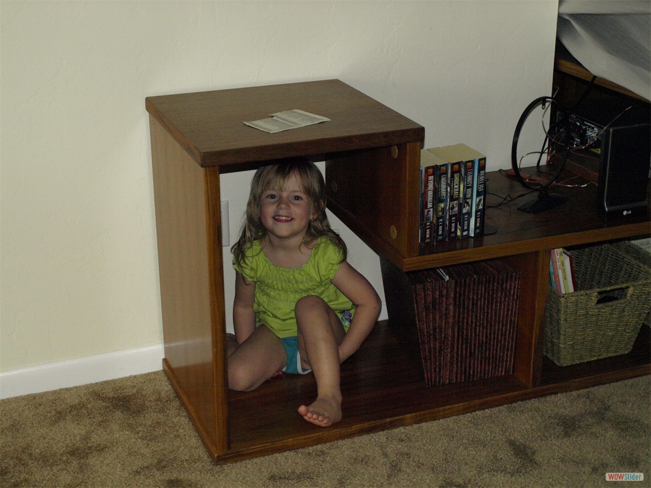 A cheeky grandchild is hiding in our shelves